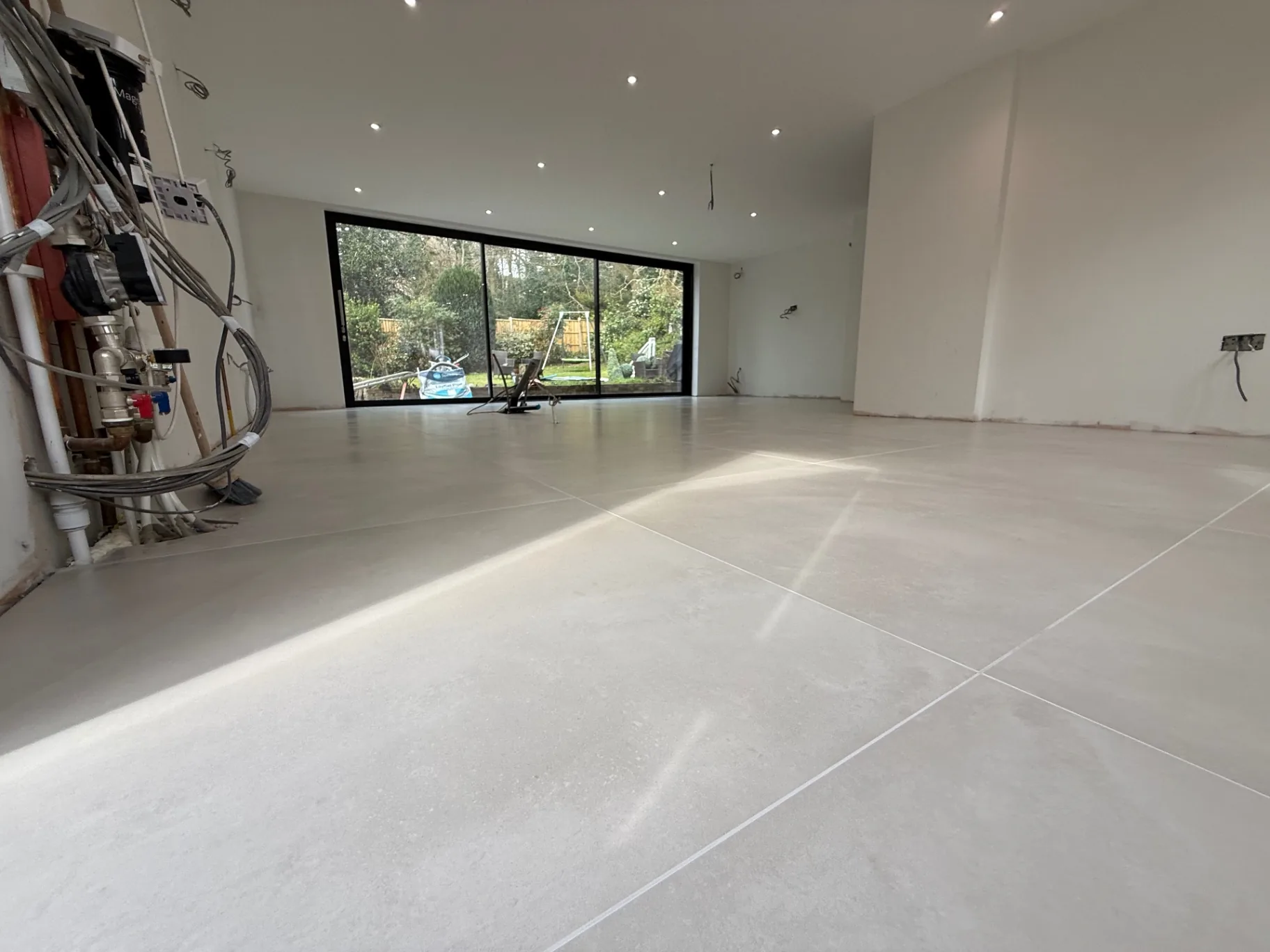 Large-format porcelain laid with full adhesive coverage