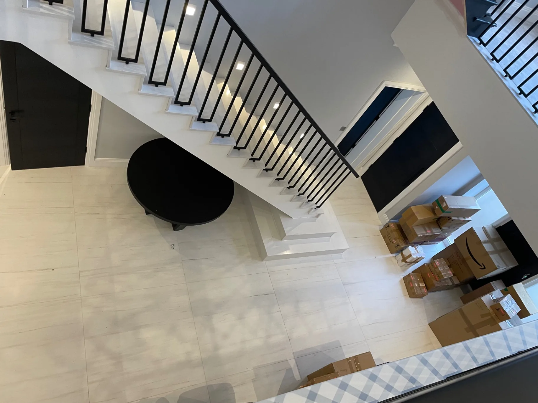 Entrance floor and staircase seen from the landing above