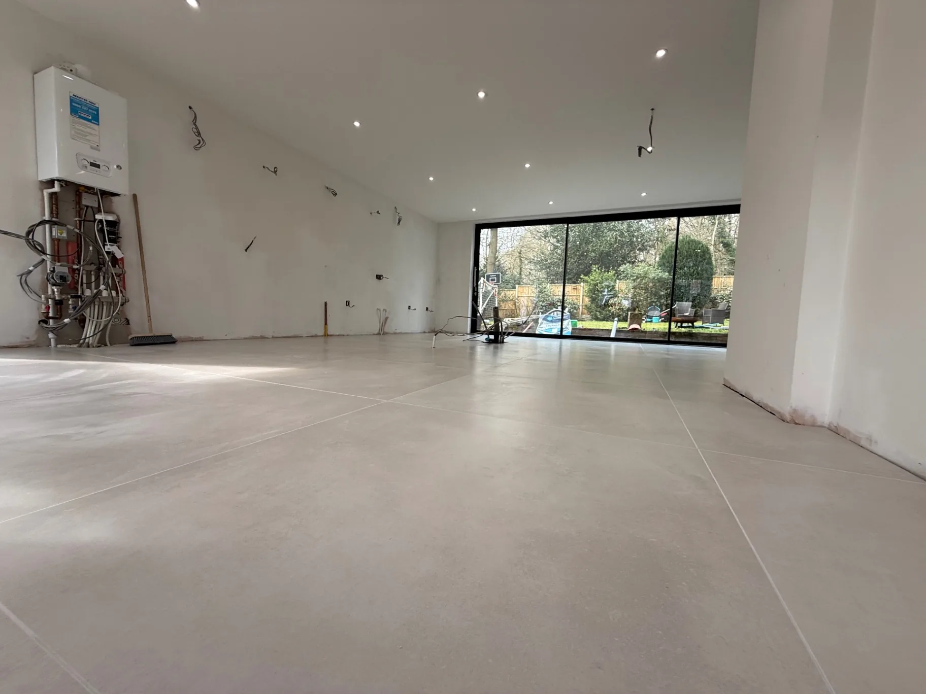 Open-plan extension with grey porcelain floor before the kitchen fit