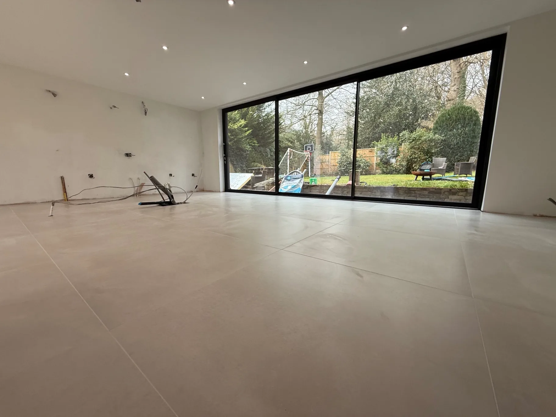 1200 × 600 grey porcelain floor running to bi-fold doors